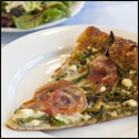 Slice of pizza on a white plate